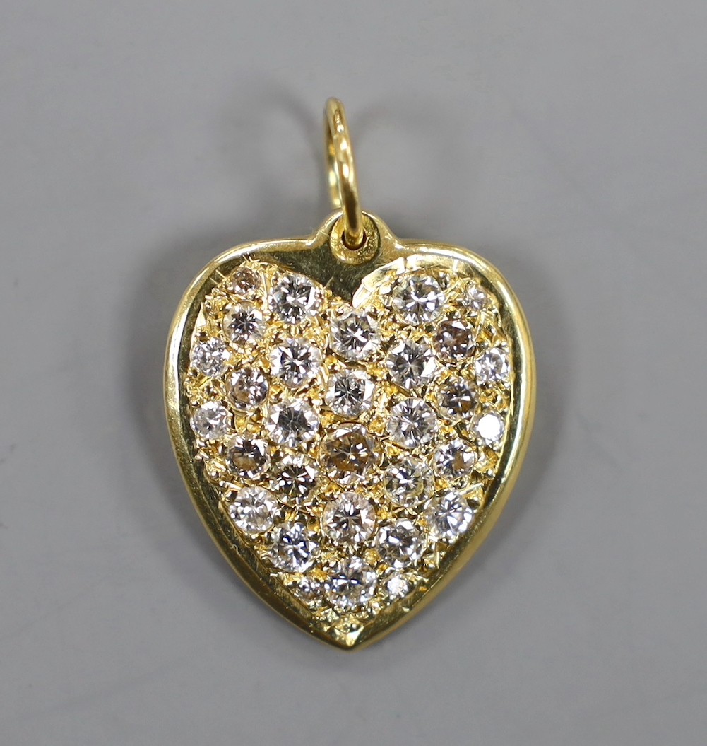 A modern 18ct gold and pave set diamond heart shaped pendant, overall 27mm, gross weight 11.3 grams.